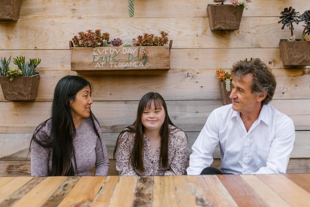 Family enjoying quality time together outdoors, fostering love and conversation.
